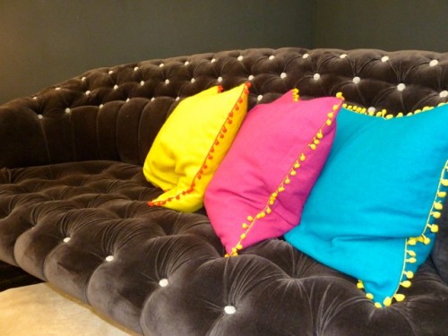 Graham and Green Jester sofa with Gypsy cushions   Decorex