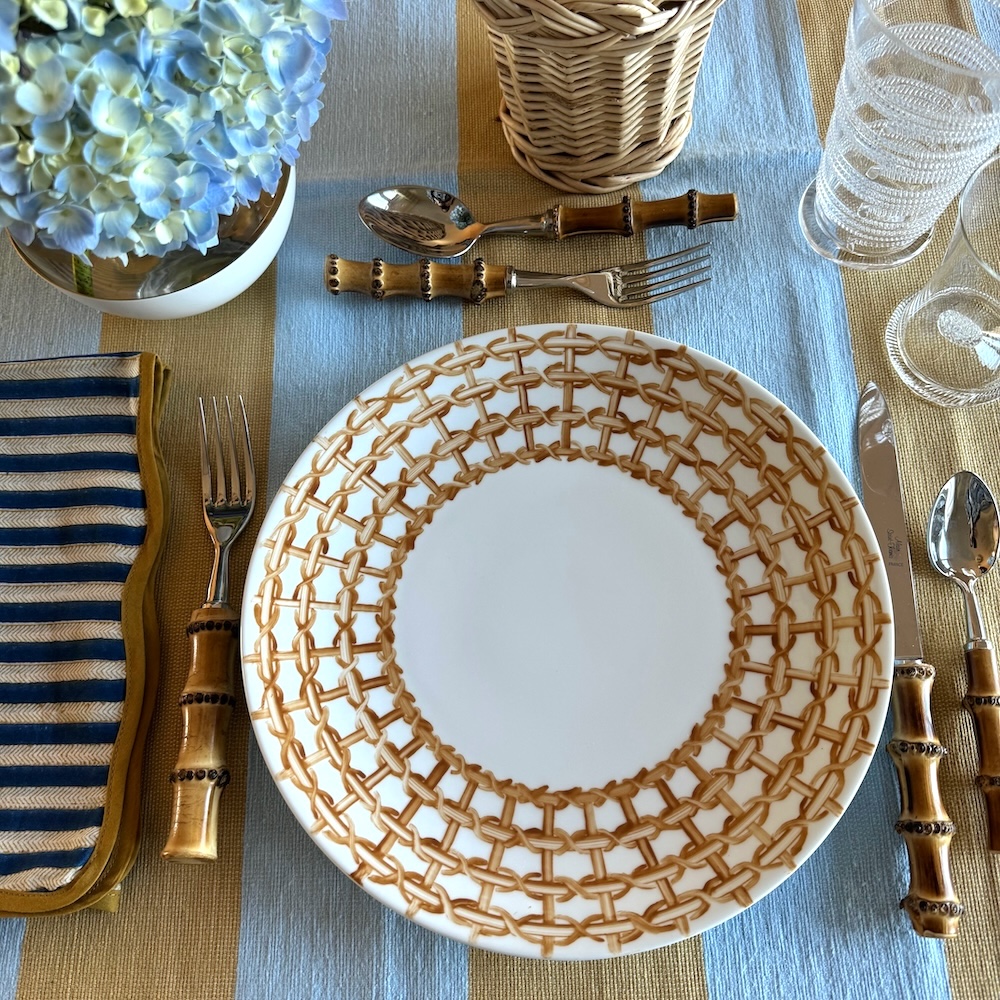 Hand painted wicker dinner plate via Quintessence
