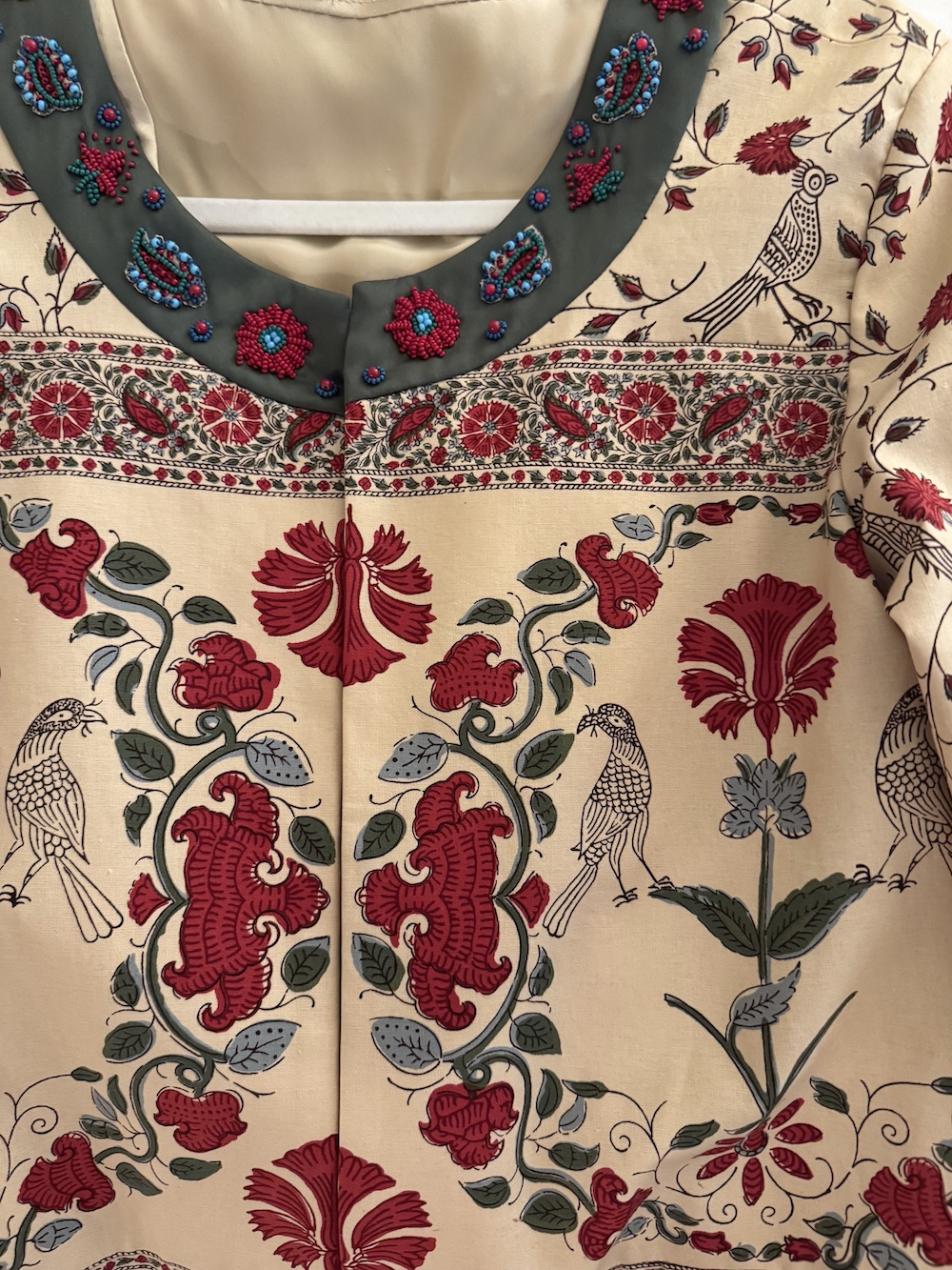 Hand embroidered collar on bespoke jacket for Stacey Bewkes of Quintessence
