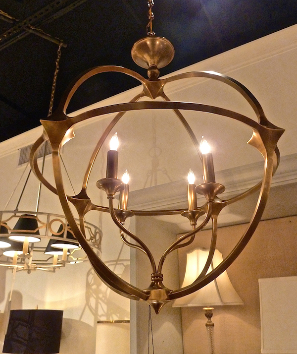Currey Ballario orb chandelier in antique brass gold at high point