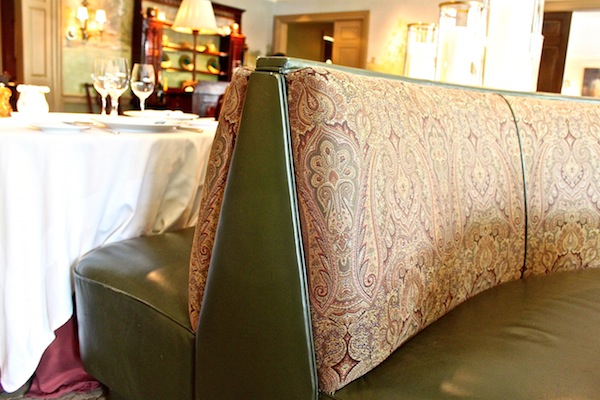 Mayflower Inn dining room banquette detail Green leather and paisley banquettes
