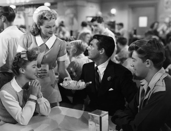 Susan Turner (Shirley Temple) and Richard Nugent (Cary Grant) in an ice cream parlor in The Bachelor and the Bobby-Soxer The Bachelor and the Bobby-Soxer