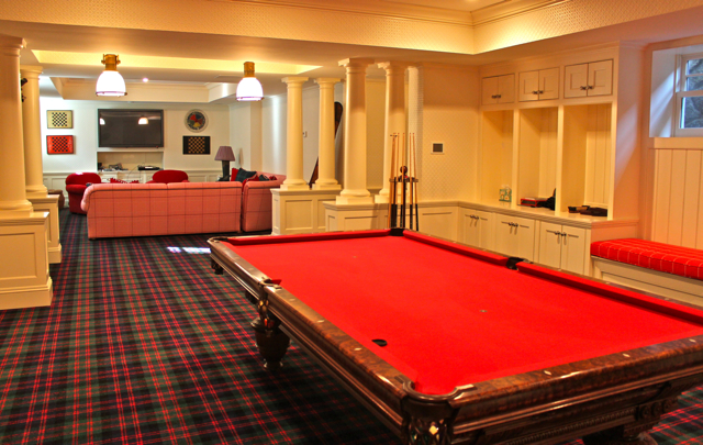 Basement with pool table in Diamond Baratta designed house Luxury game room