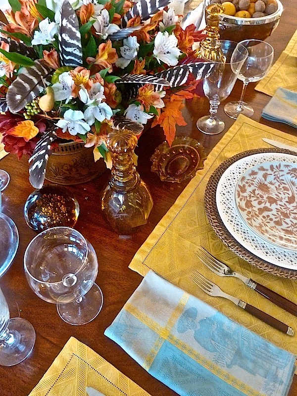 Thanksgiving arrangement with feathers in the flowers Happy Thanksgiving