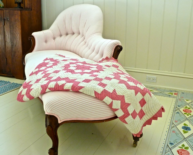 Antique chaise updated with pink ticking fabric and homemade quilt Diamond Baratta designed Connecticut house